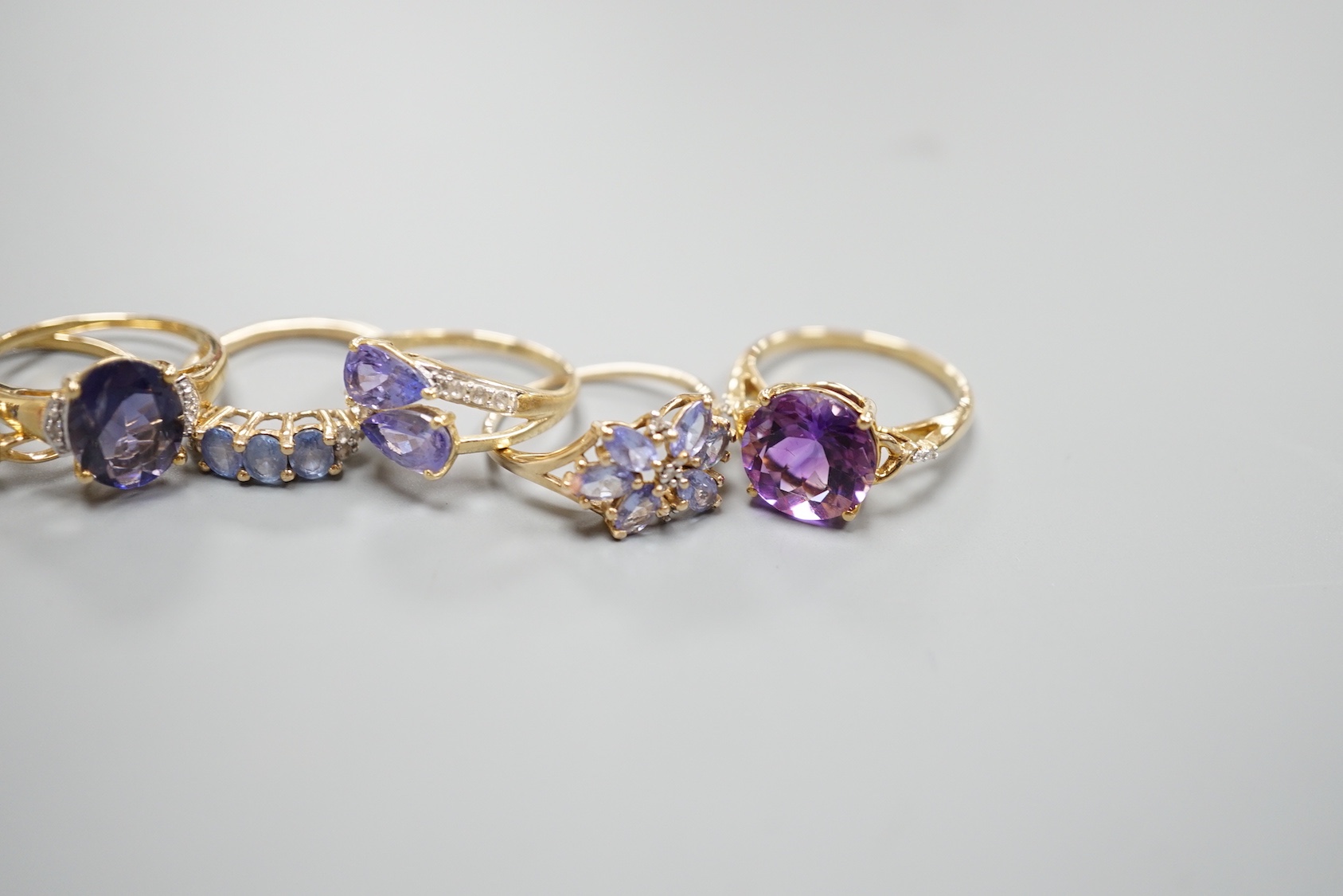 Six assorted modern 9ct gold gem set rings, including amethyst, gross 13.9 grams, a similar 14ct gold ring, gross 2.5 grams and a 925 ring.